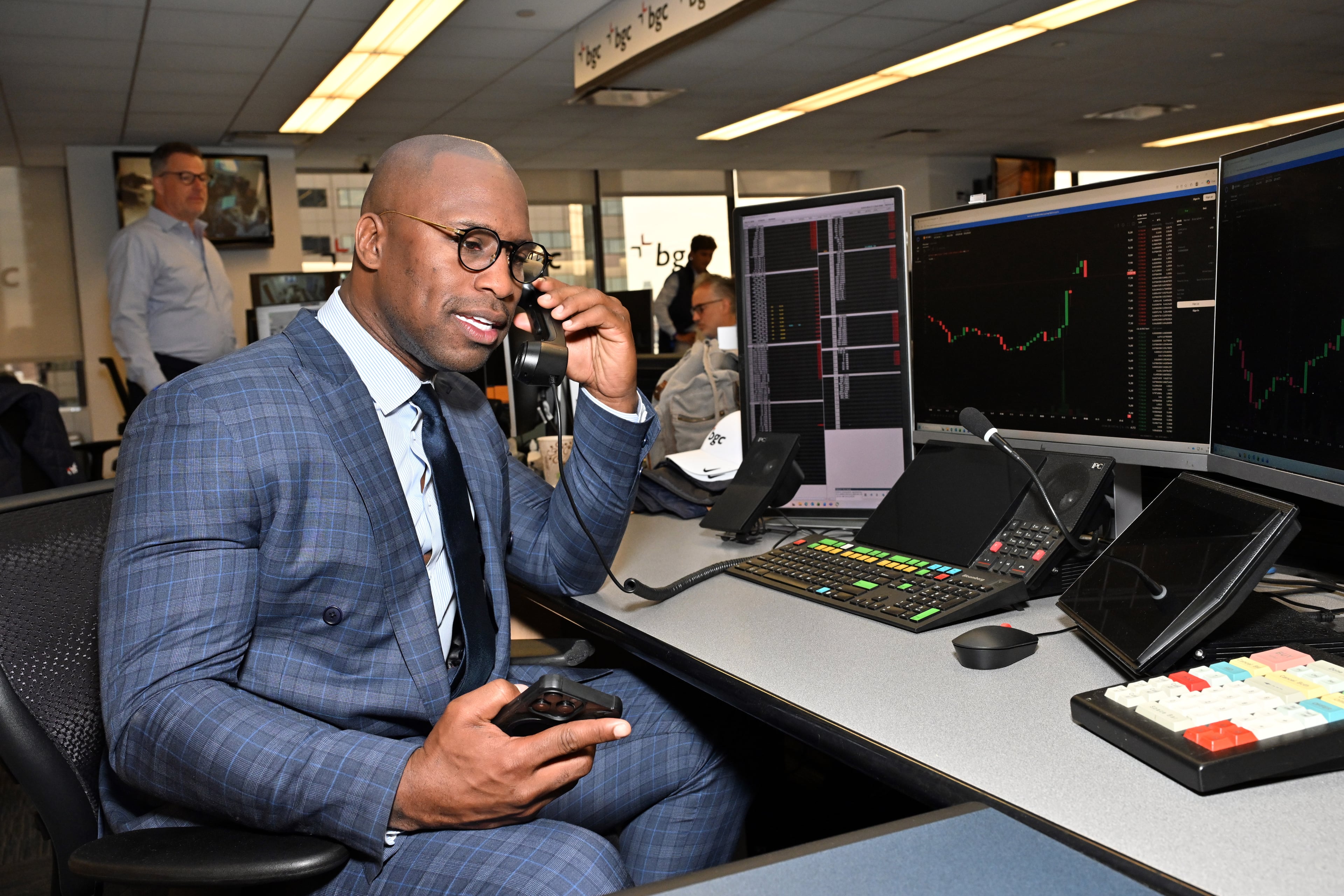 Vernon Davis on the phone at the Cantor Fitzgerald trading desk